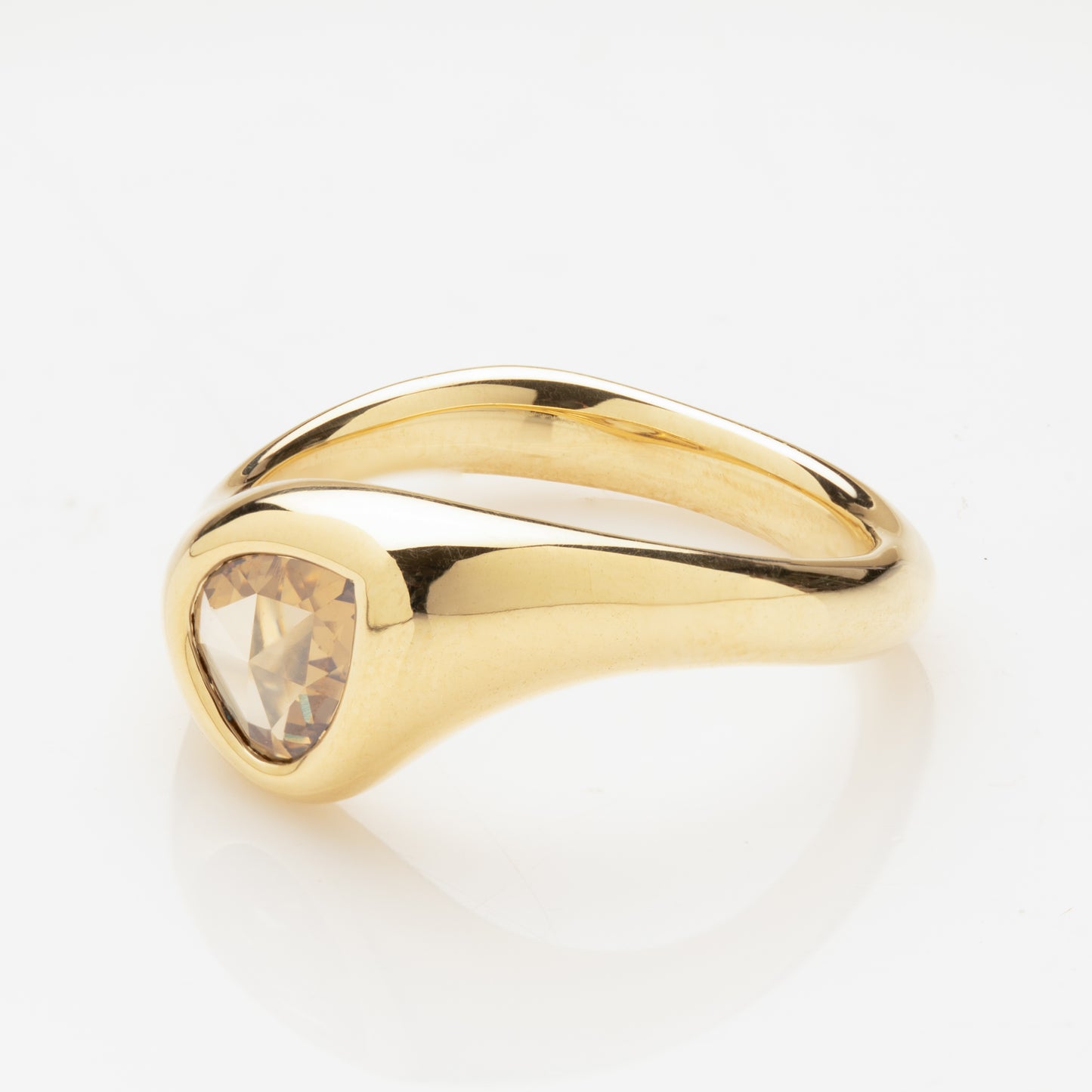 Side view of an 18k yellow gold ring with a champagne-colored pear-shaped rose-cut diamond.
