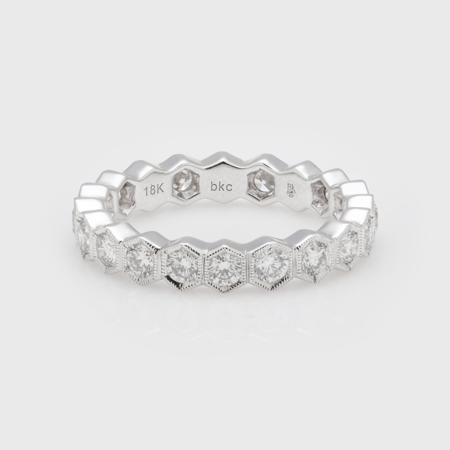 Close-up of a ring in 18k white gold set with diamonds.