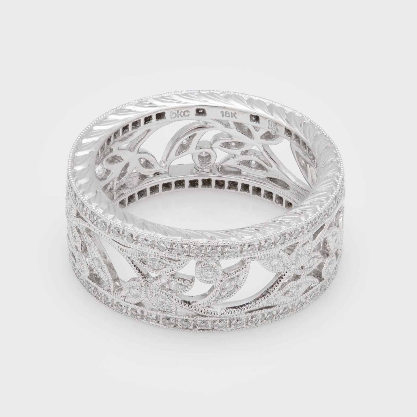 Close-up of an 18k white gold ring with diamonds.