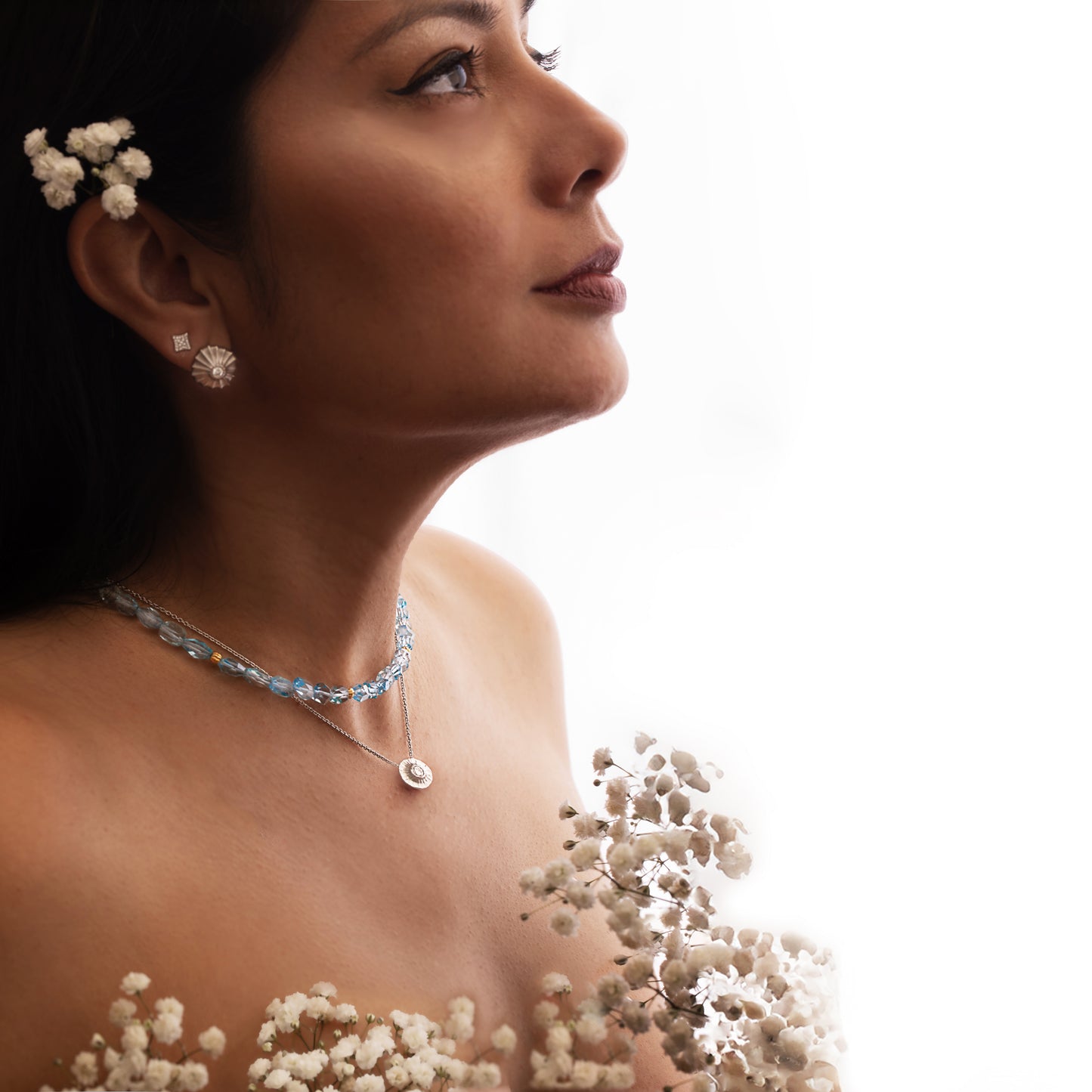 Side view of a platinum necklace with diamond.