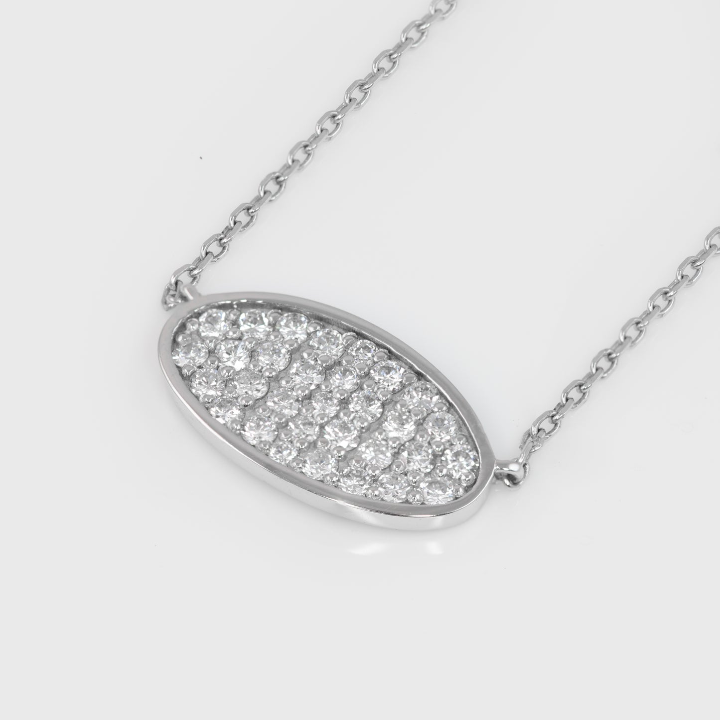 Close-up of a 14k white gold necklace with diamonds.