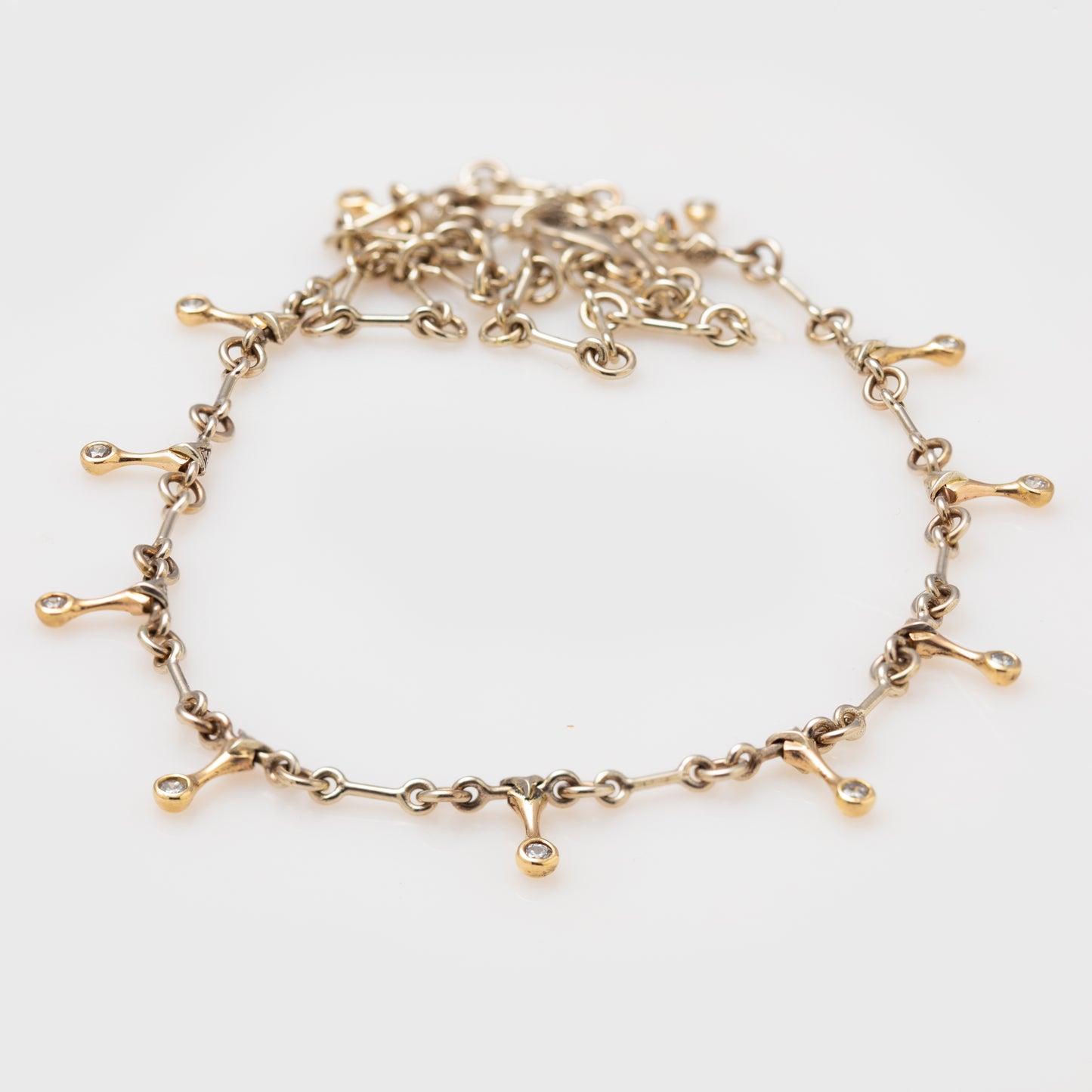 Chain necklace with 14k bicolor gold and round brilliant cut diamonds.