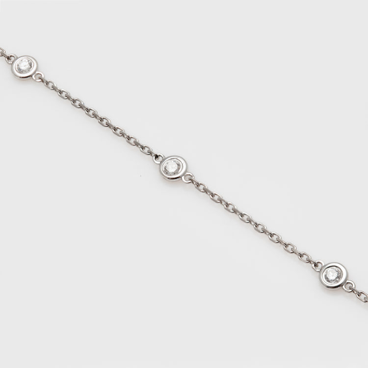 Close-up of an 18k white gold bracelet with diamonds.