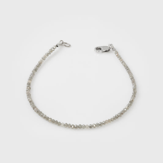 Grey bracelet on a light gray background