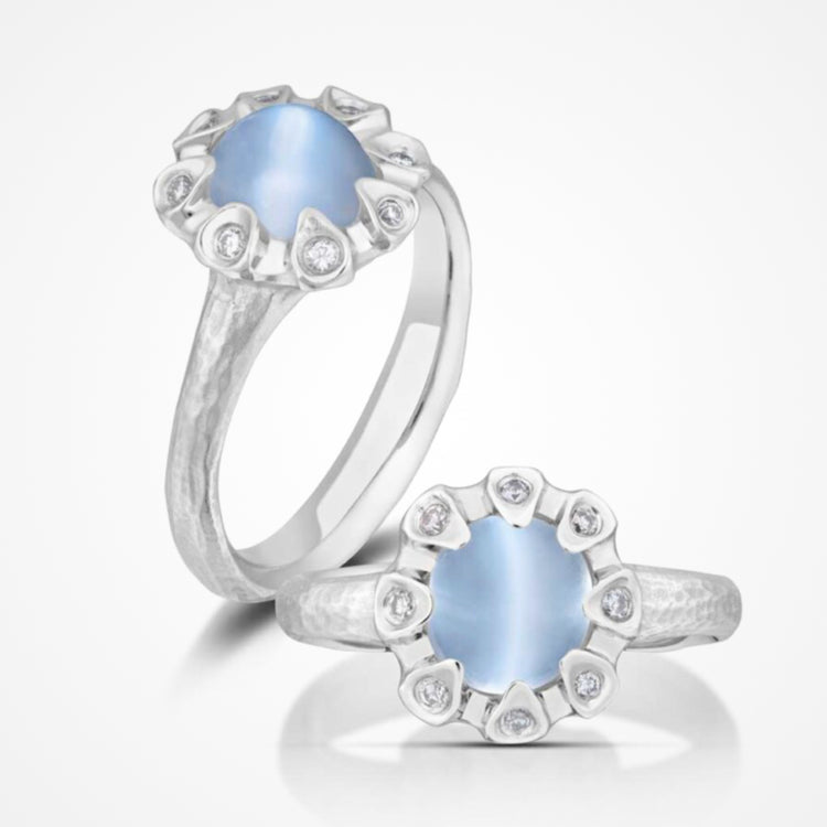 Close-up of a platinum ring with moonstone and diamonds.