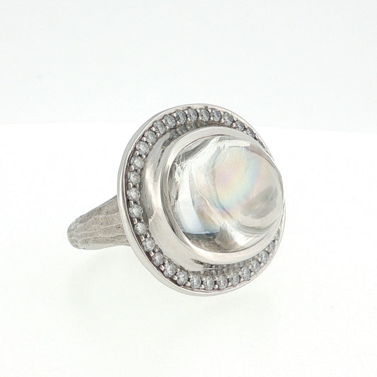 Platinum ring featuring a large oval multicolor stone surrounded by diamonds and a textured band, photographed on a white background.
