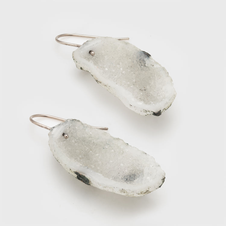 Side view of white geode earrings in 18k white gold.