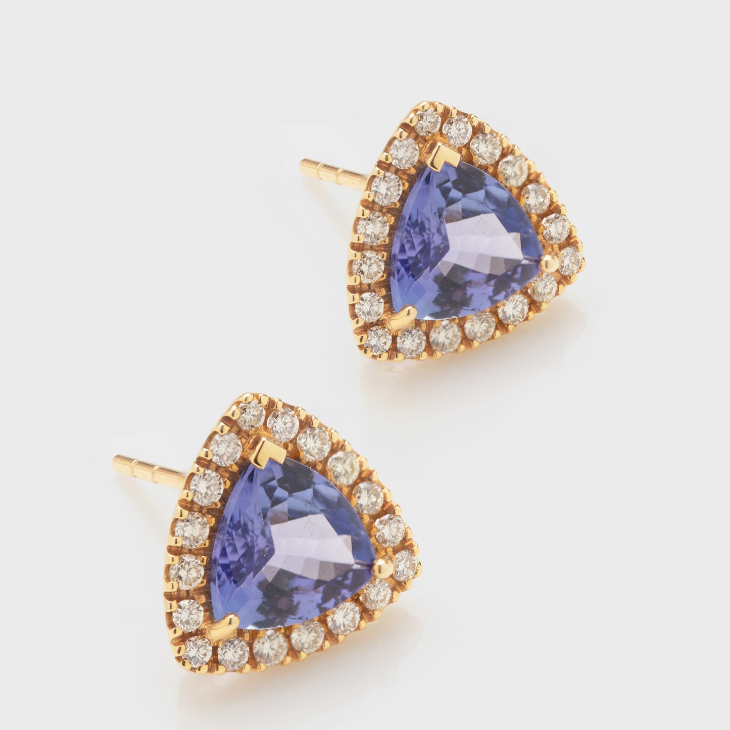 Tanzanite halo stud earrings.