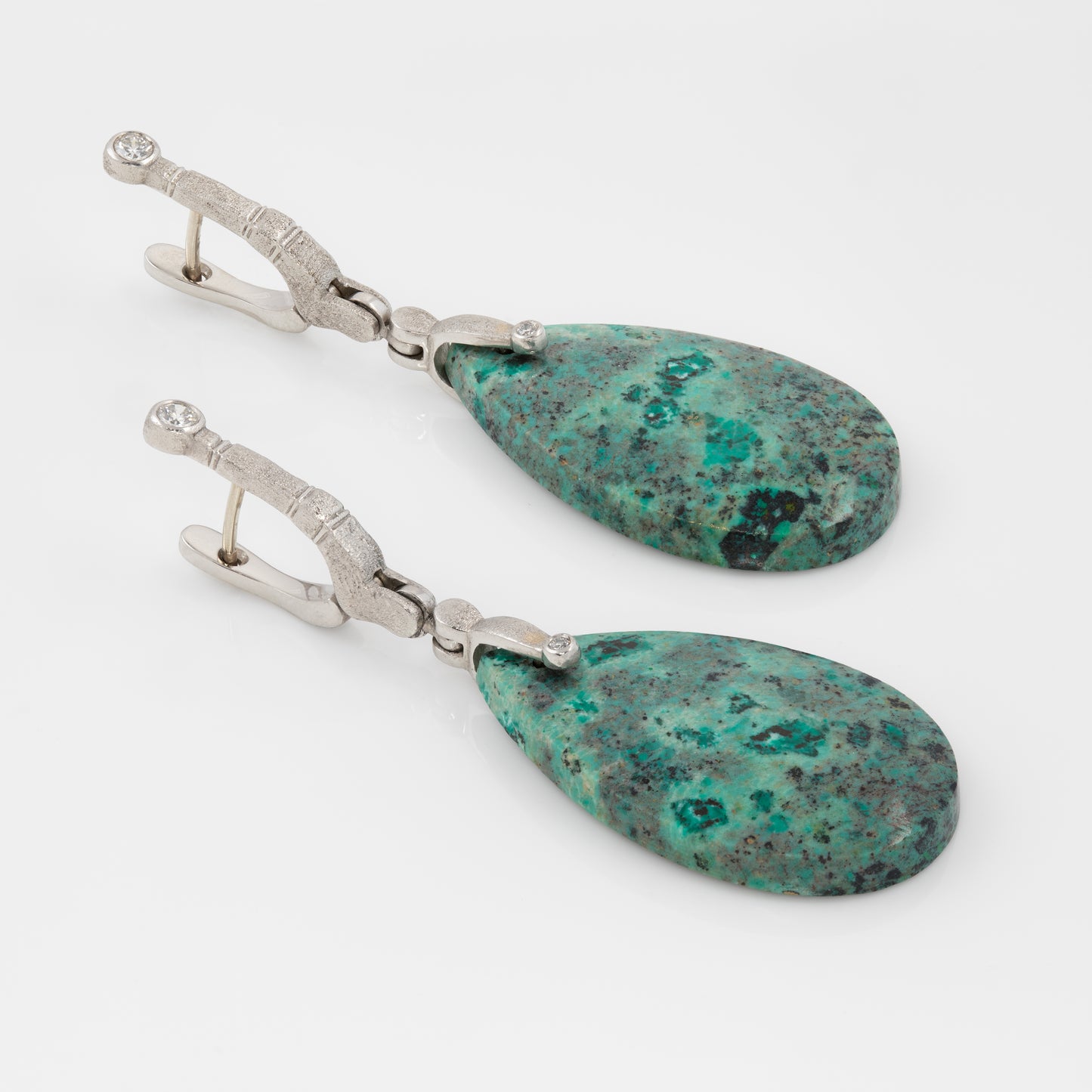 Platinum earrings with diamonds and Sonoran Sunrise.