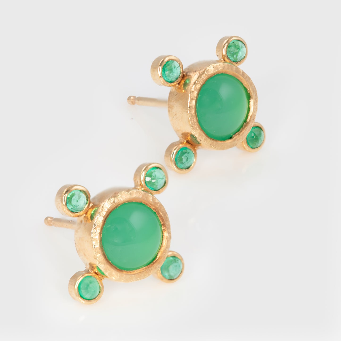Pair of gold earrings with green gemstones.