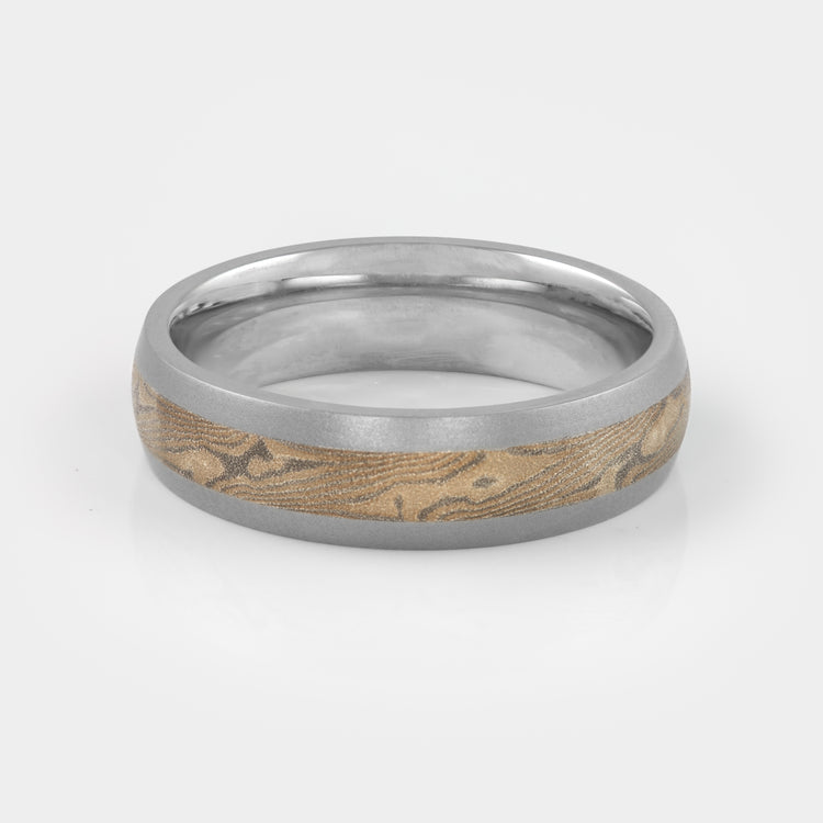 Side view of a cobalt chrome, palladium & sterling silver band with bead blast finish.