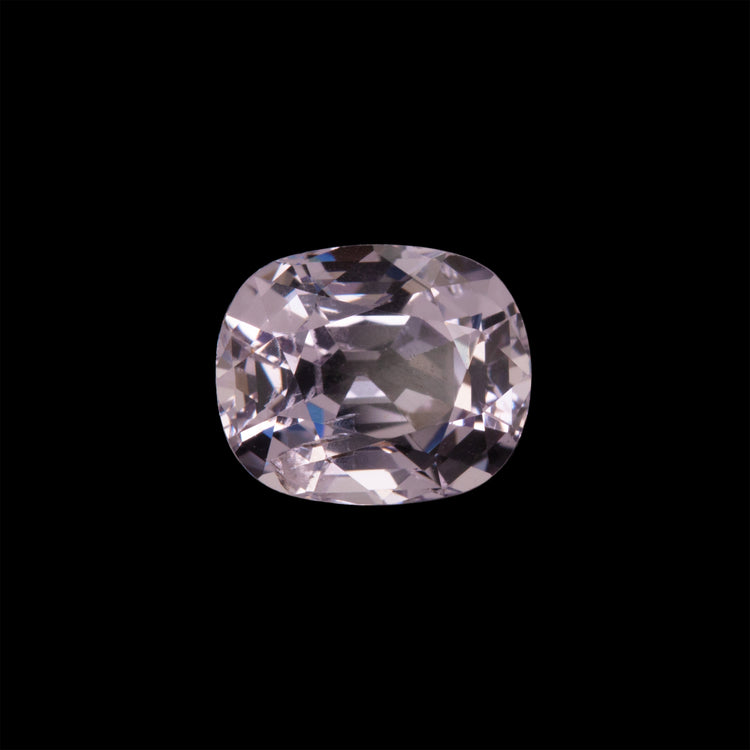 Cushion-cut pink spinel gemstone on a black background
