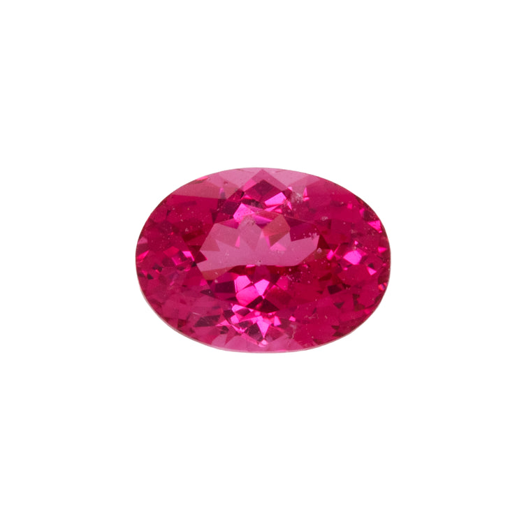 Red gemstone on a white background.