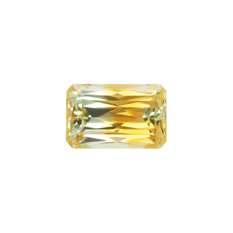 Yellow sapphire gemstone on a white background