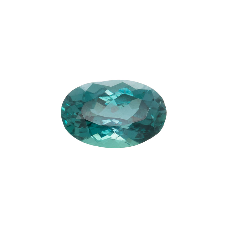 Teal gemstone on a white background