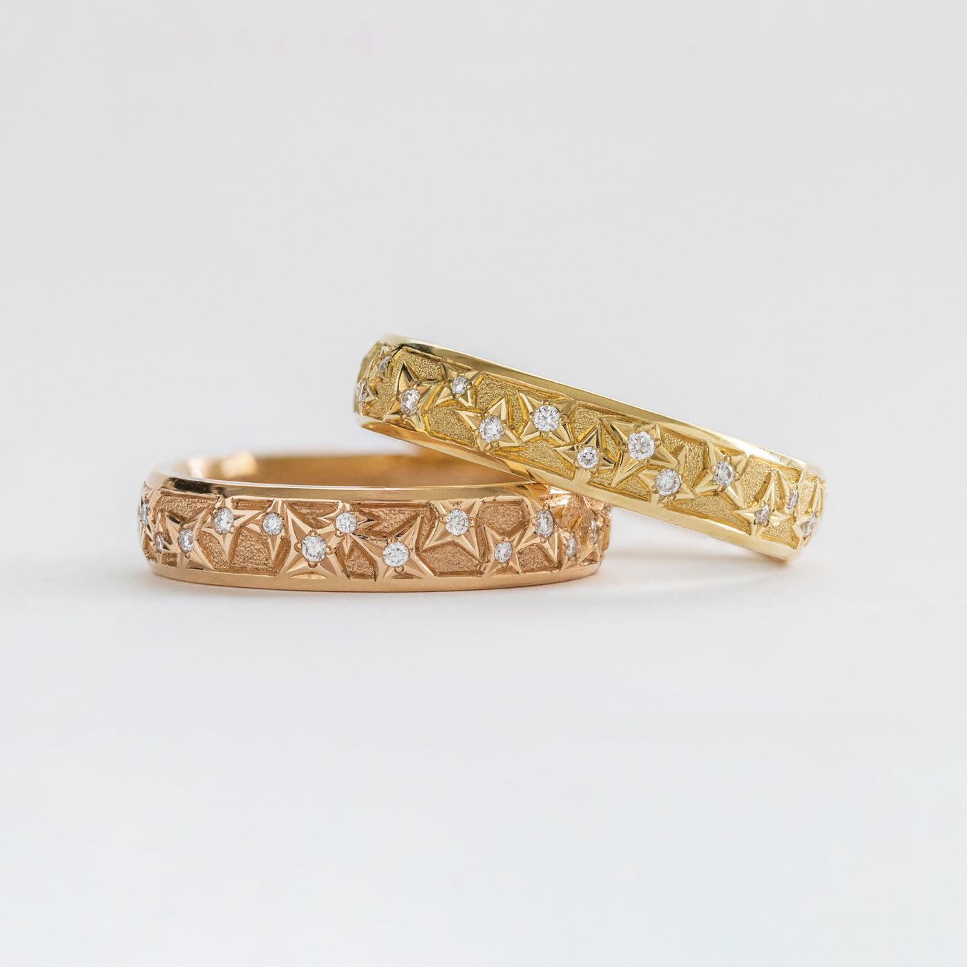 Close-up of an 18k rose gold band with natural diamonds.