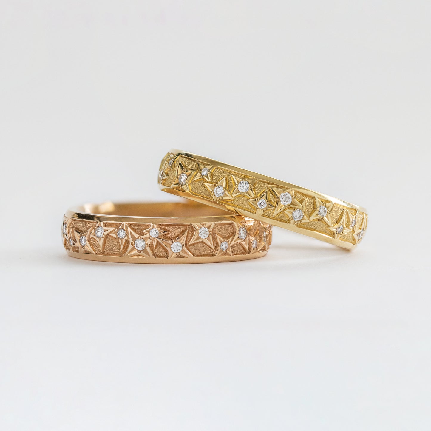 Close-up of an 18k rose gold band with natural diamonds.