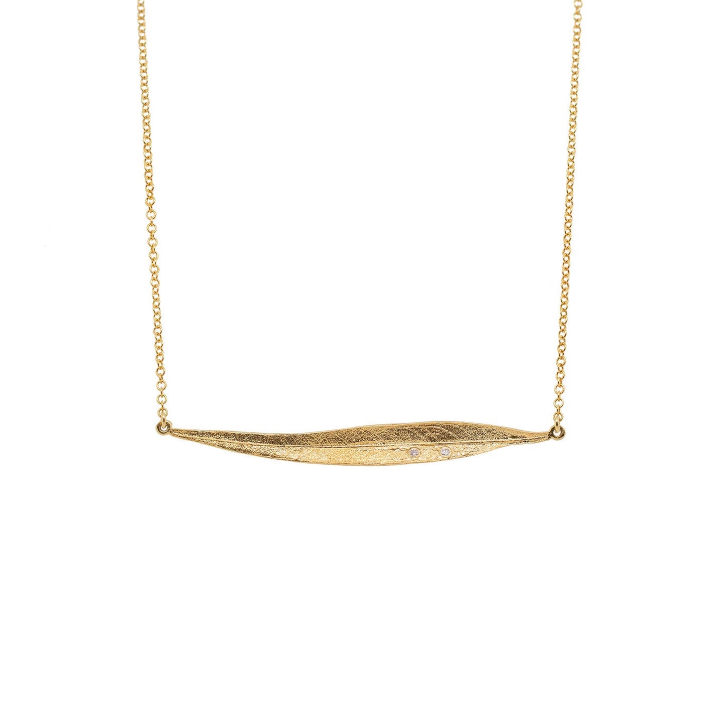 Front view of a 14k yellow gold pendant with diamonds.