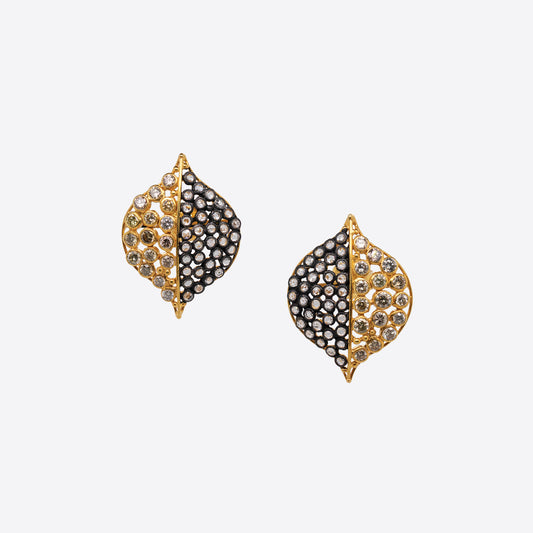 Earrings featuring round gems set in yellow and black metal