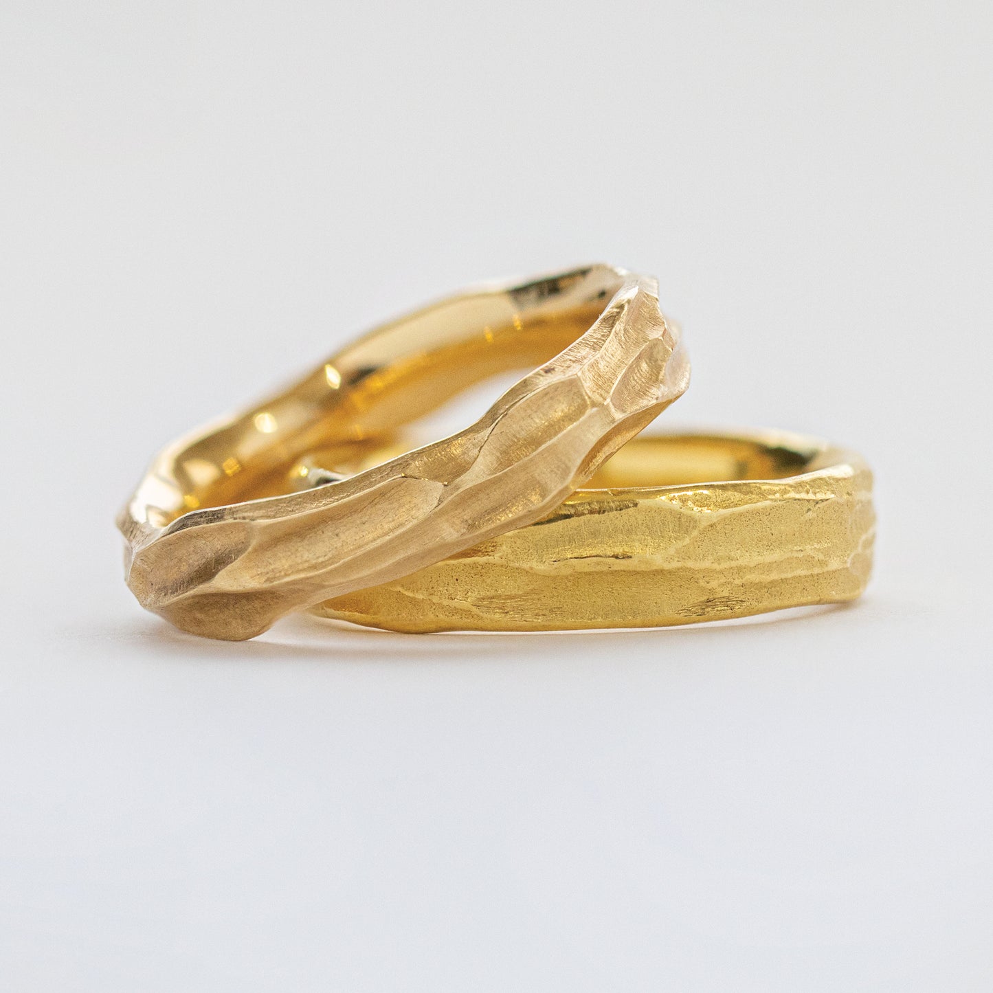 Stack of two yellow metal bands with redwood bark texture