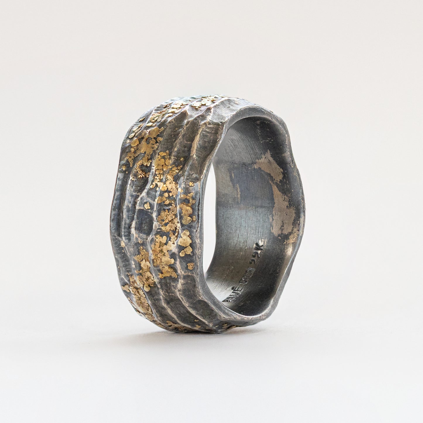 Upright view of oxidized and yellow metal redwood bark "burl" texture band