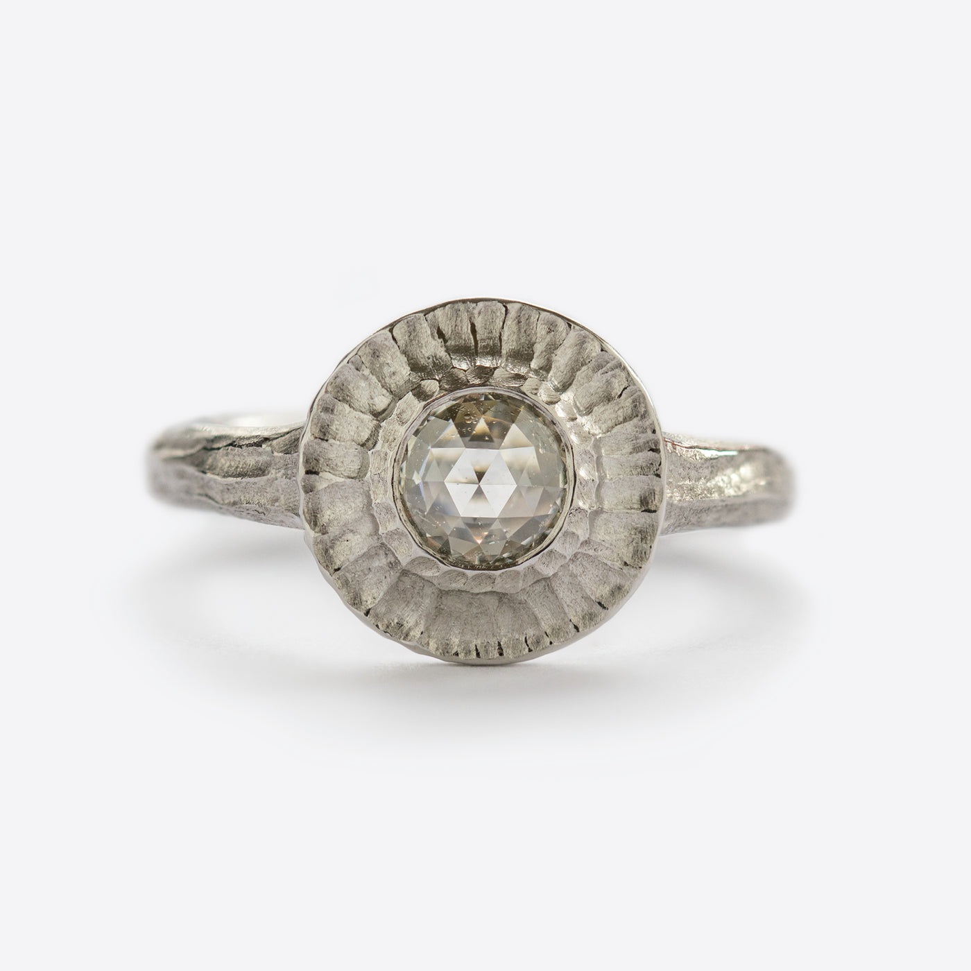 White metal ring with round gem