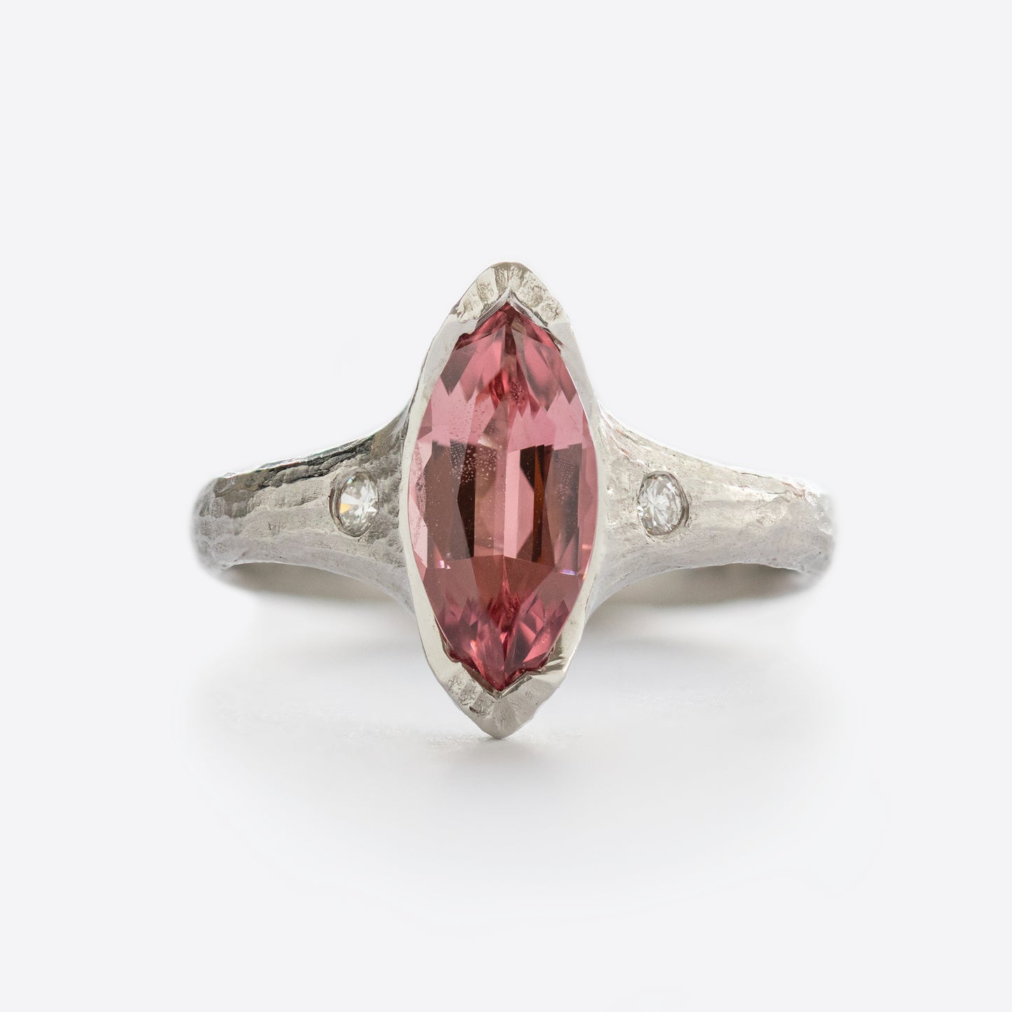 White metal ring with pink and white gems
