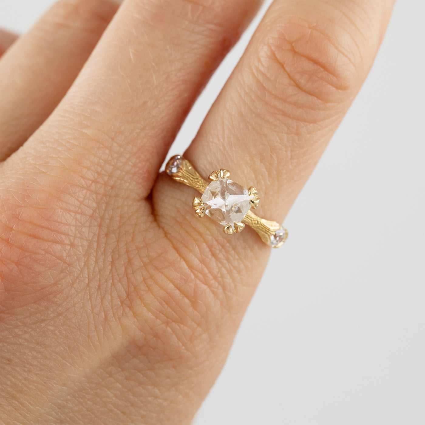 Gold ring with diamond on hand