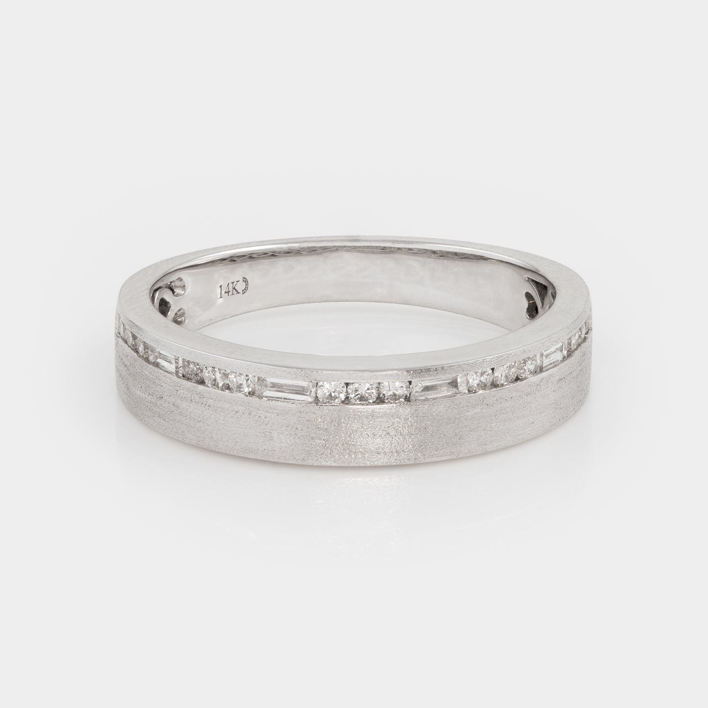 Silver band with diamonds on a light gray background