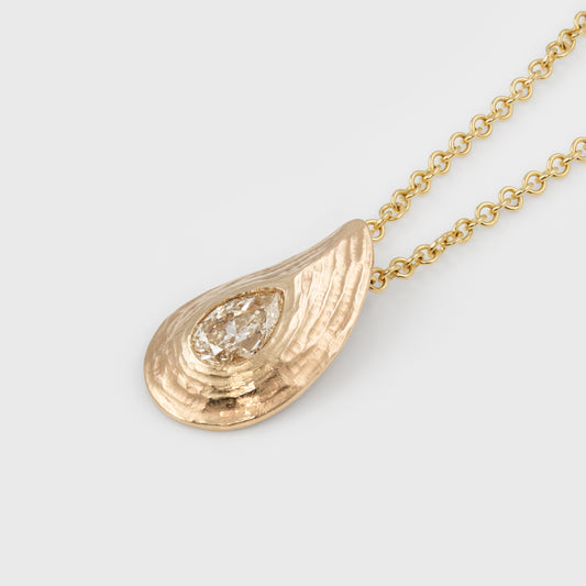 Pear shaped gold pendant with redwood bark texture