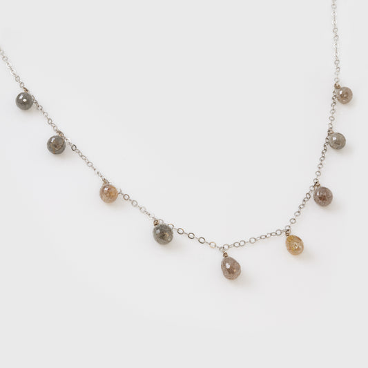 Necklace with small beads on a light background