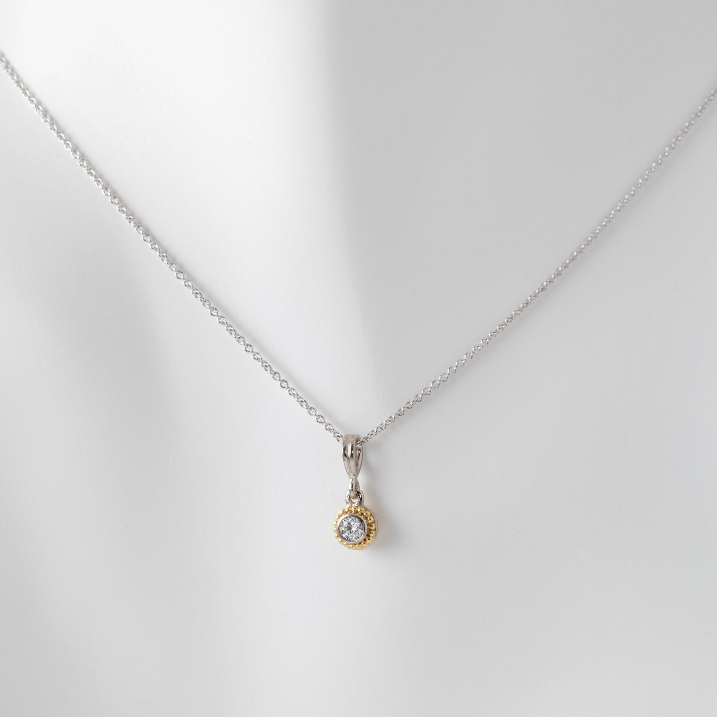Necklace with a pendant on a light gray background