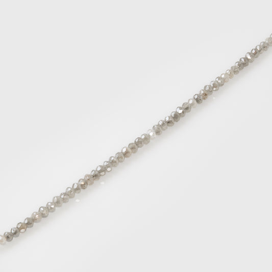 Close-up of a diamond bracelet on a light gray background
