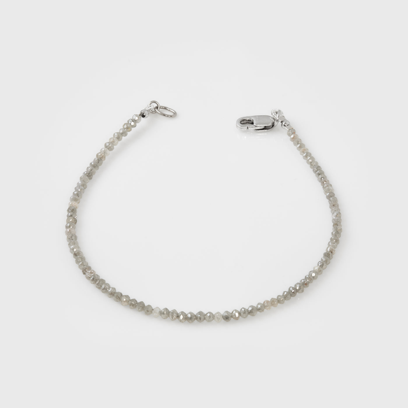 Grey bracelet on a light gray background