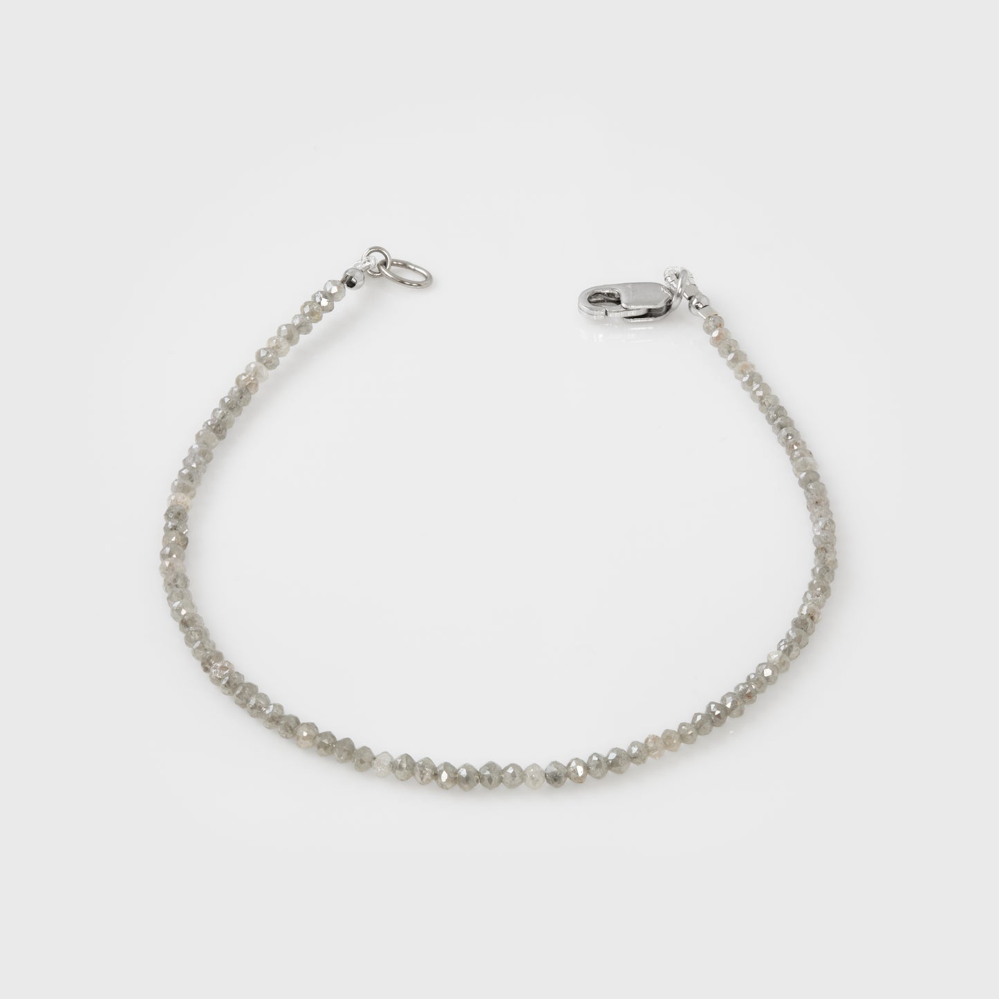Grey bracelet on a light gray background