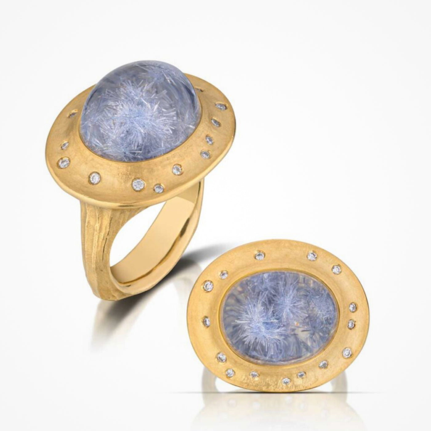 A yellow gold ring with a blue dumortierite gemstone and diamond accents.