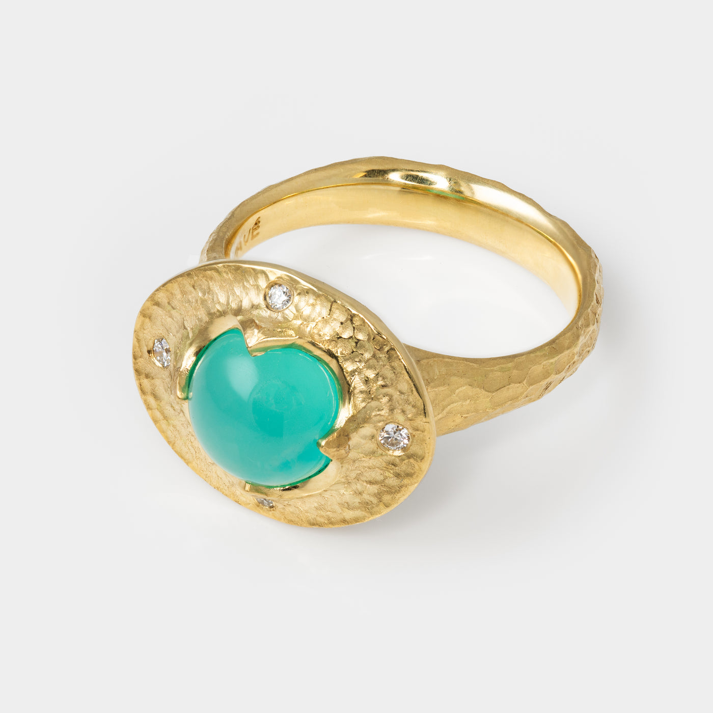 Gold ring with a chrysocolla gemstone and small diamonds on a white background