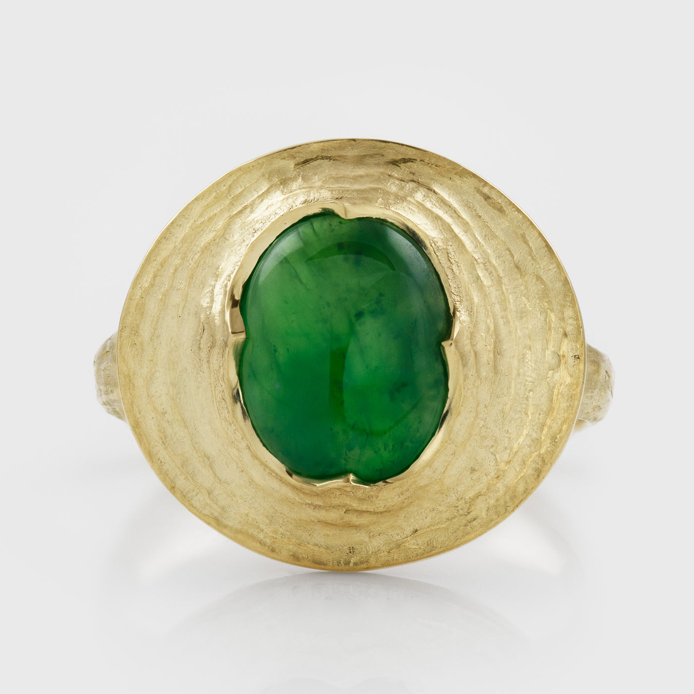Yellow gold ring featuring oval cabochon green Jade
