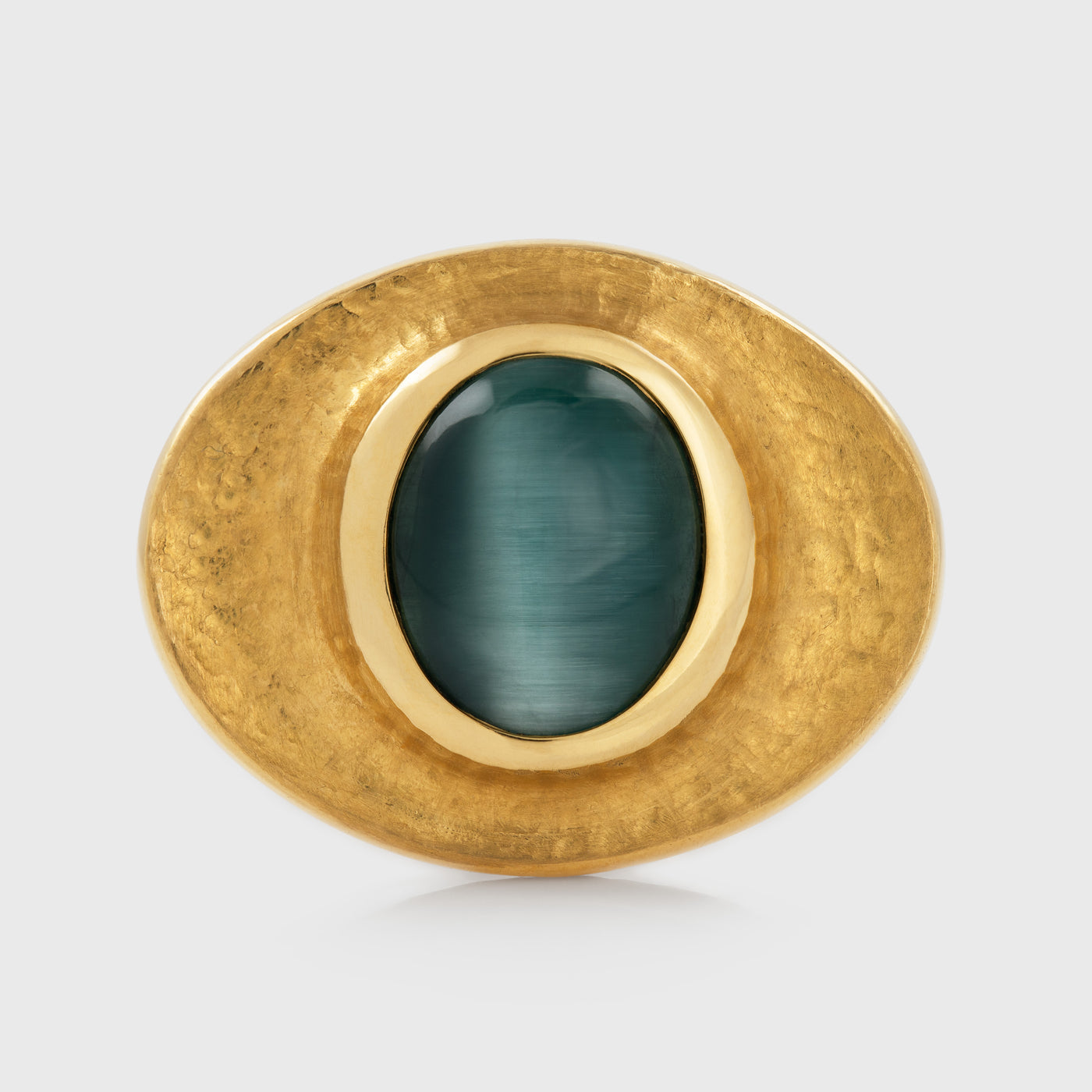 Yellow gold ring featuring bezel set blue green Cat's Eye Tourmaline