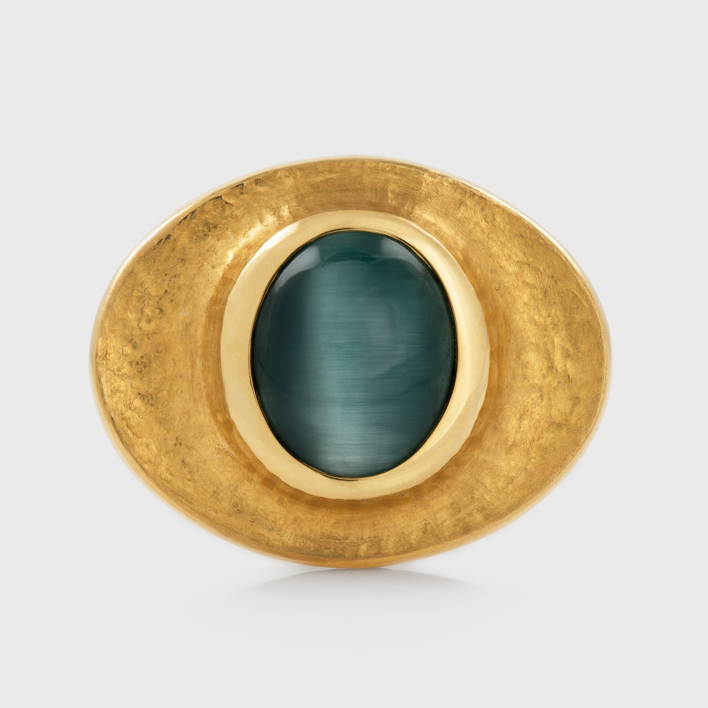 Yellow gold ring featuring bezel set blue green Cat's Eye Tourmaline