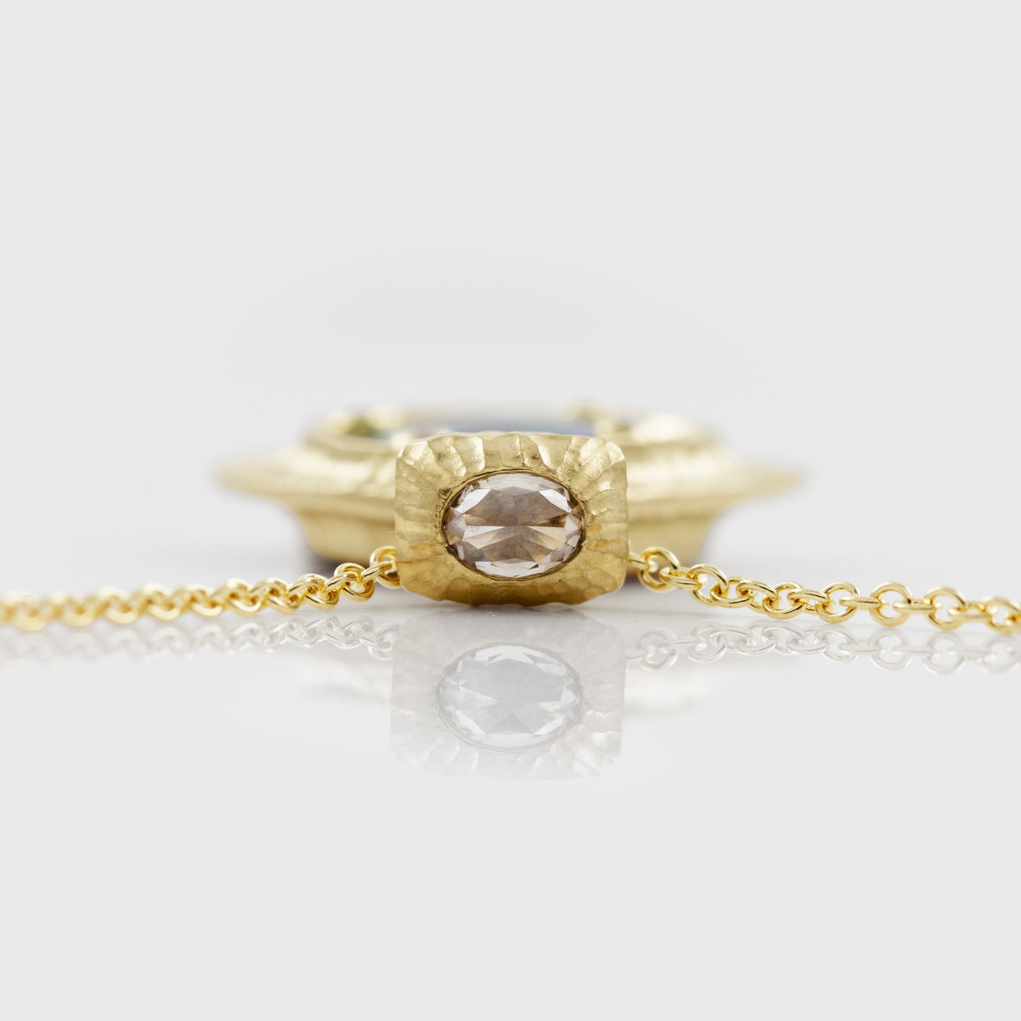 Top view of yellow gold pendant featuring rose cut Diamond