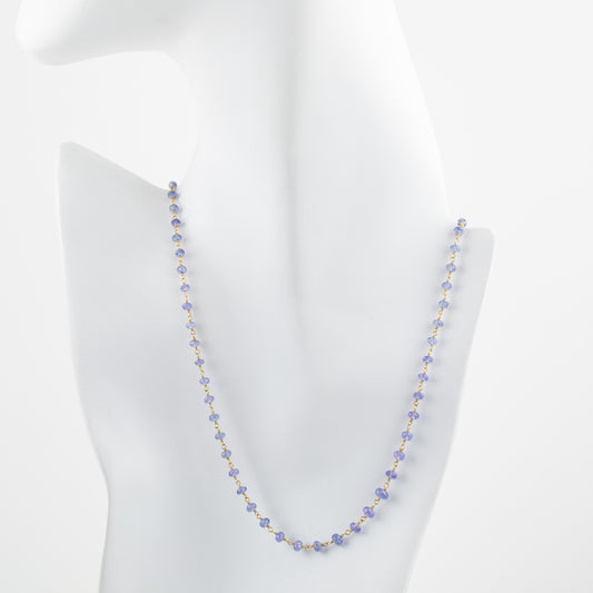 Tanzanite beaded necklace on a white mannequin bust