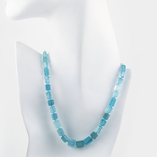 Blue beaded necklace on a white mannequin bust