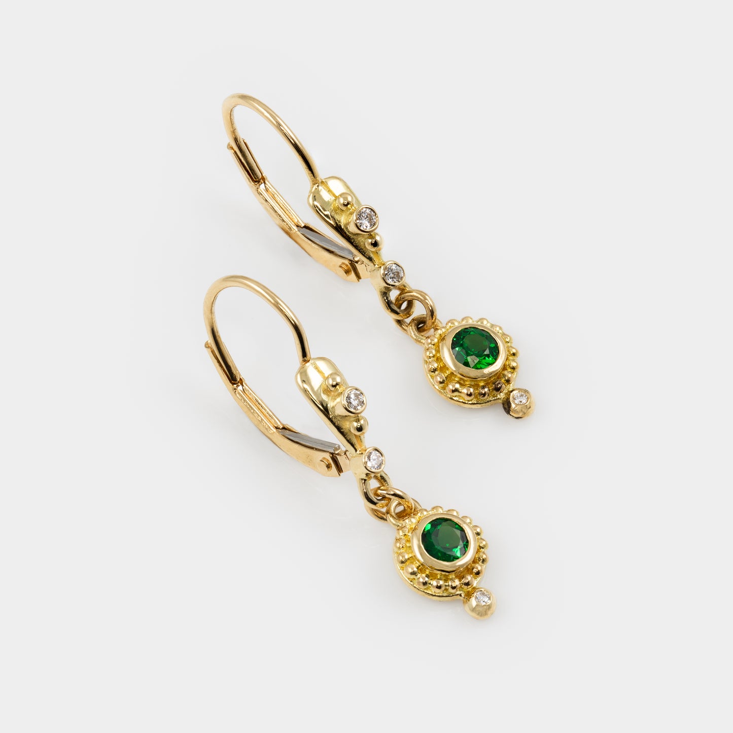 Gold earrings with green tsavorite garnet gems and granulation