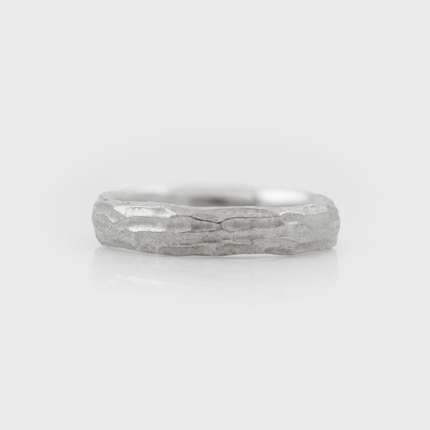 Plain platinum band with redwood bark texture on a white background front view