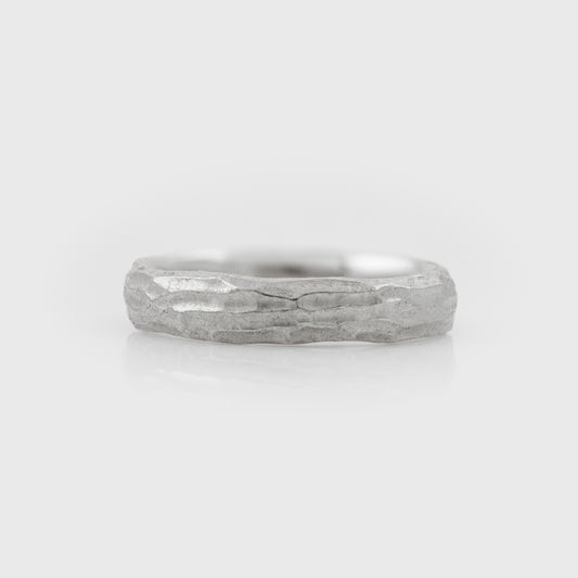 Plain platinum band with redwood bark texture on a white background front view