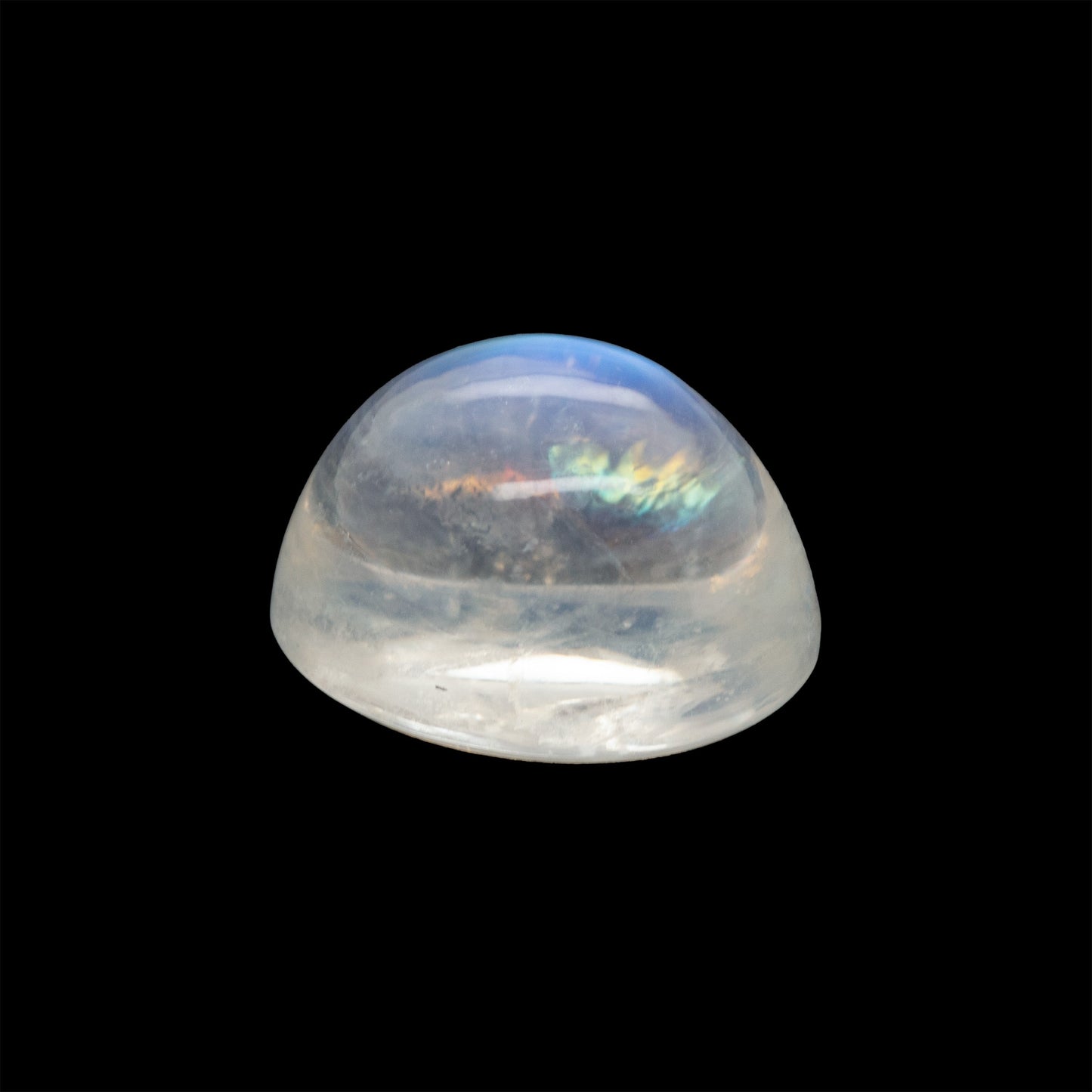 Clear moonstone gemstone with multicolored interior on a black background