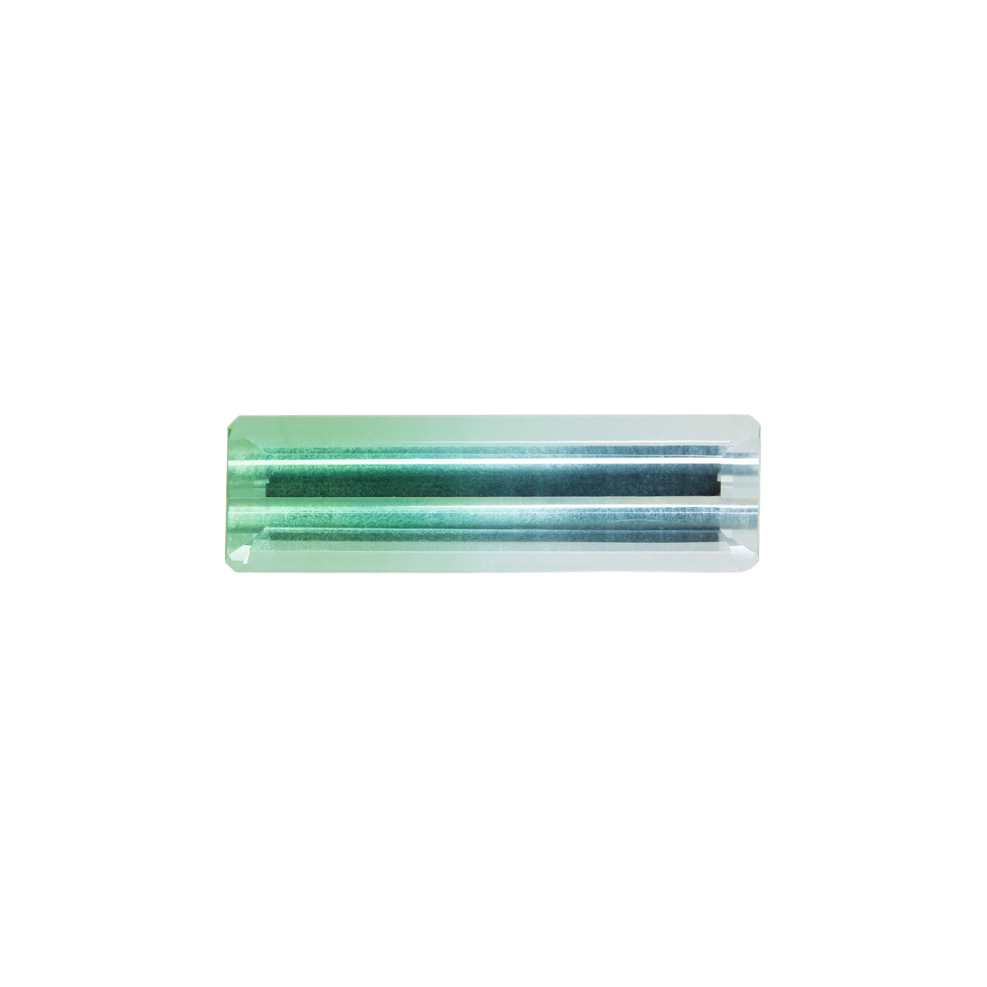 Green and blue bicolor tourmaline gemstone on a white background