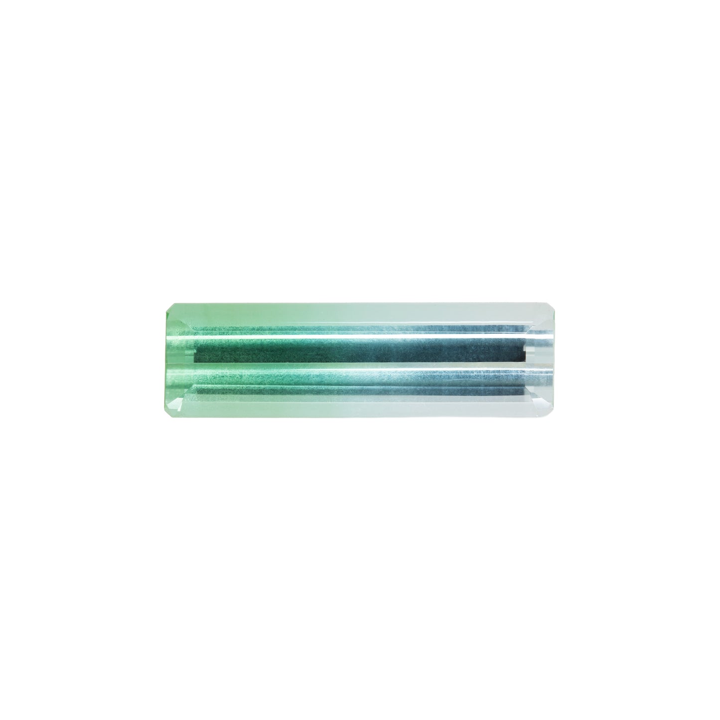 Green and blue bicolor tourmaline gemstone on a white background