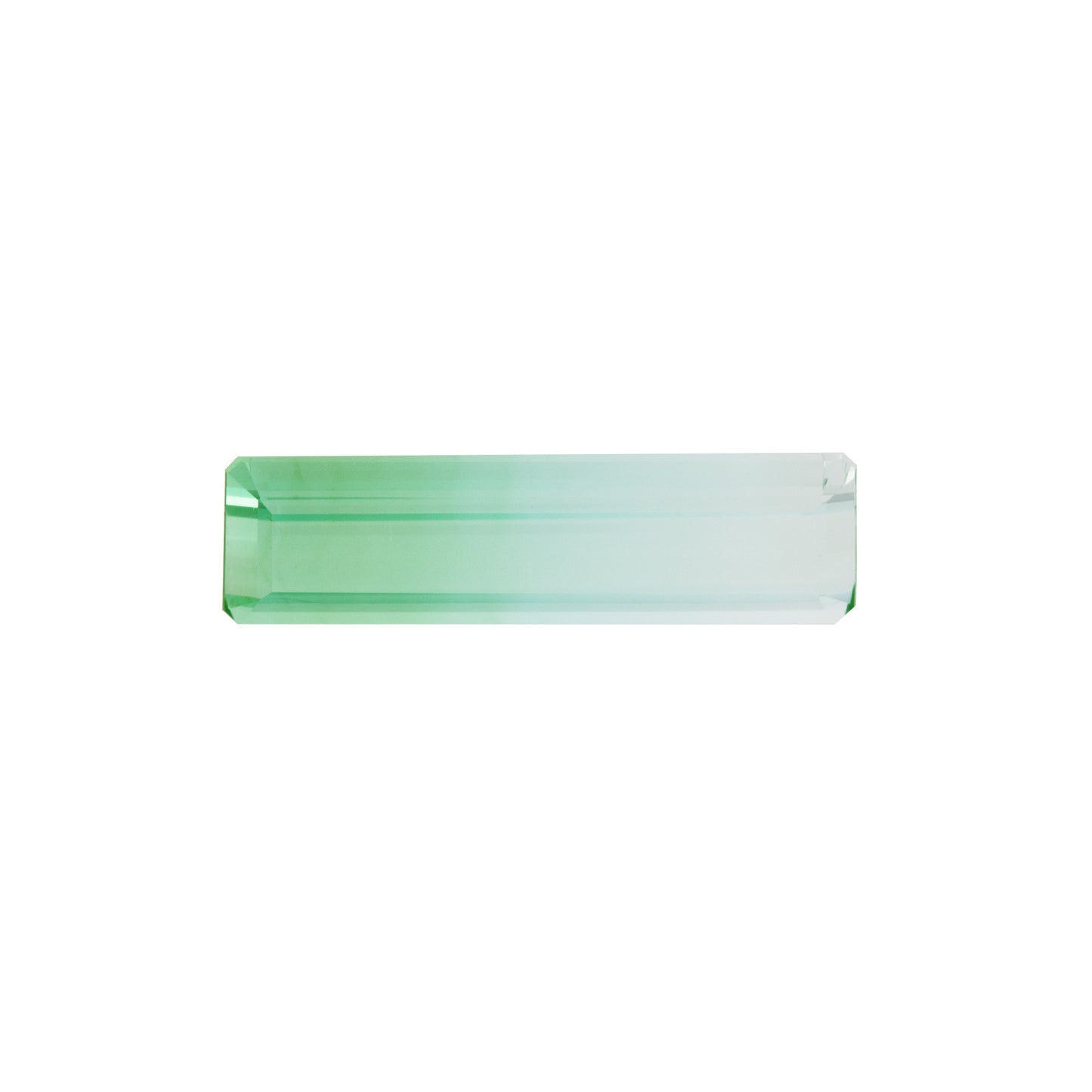 Green and blue bicolor tourmaline gemstone on a white background